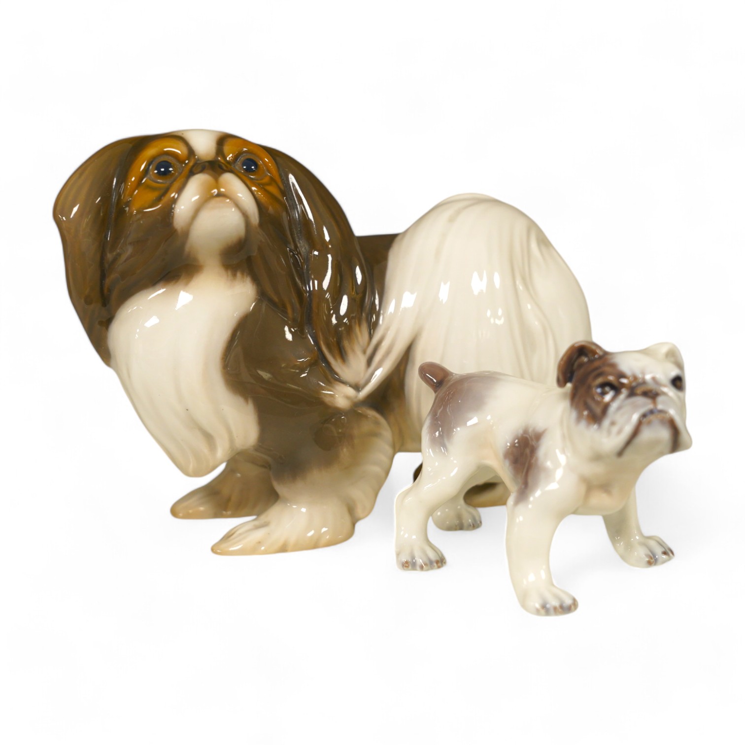 An early Bing & Grondahl figure of a Japanese Chin 12cm high, and a Dahl Jensen small bulldog, 7cm high. Condition - good